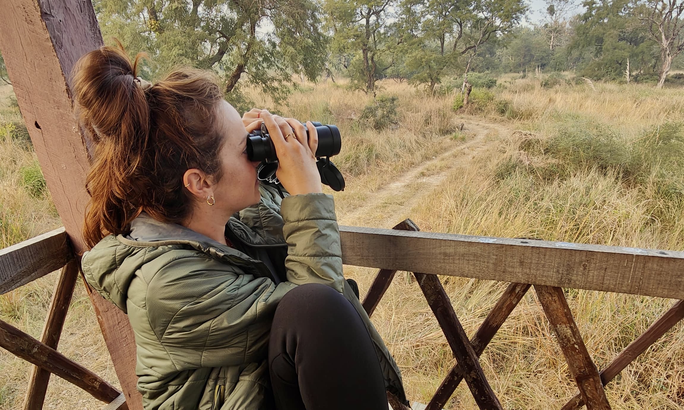 Girl looking through binoculars